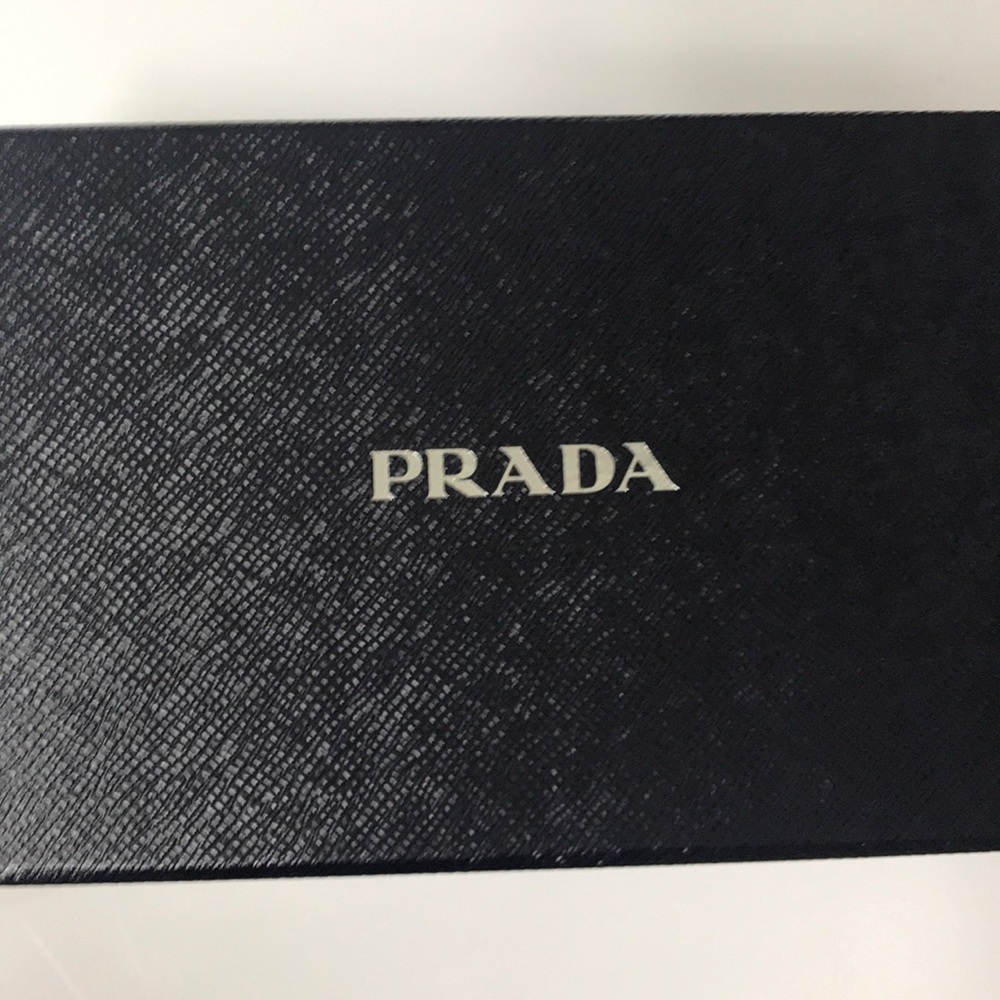 Mini Bando Saffiano Triangolo black purse.